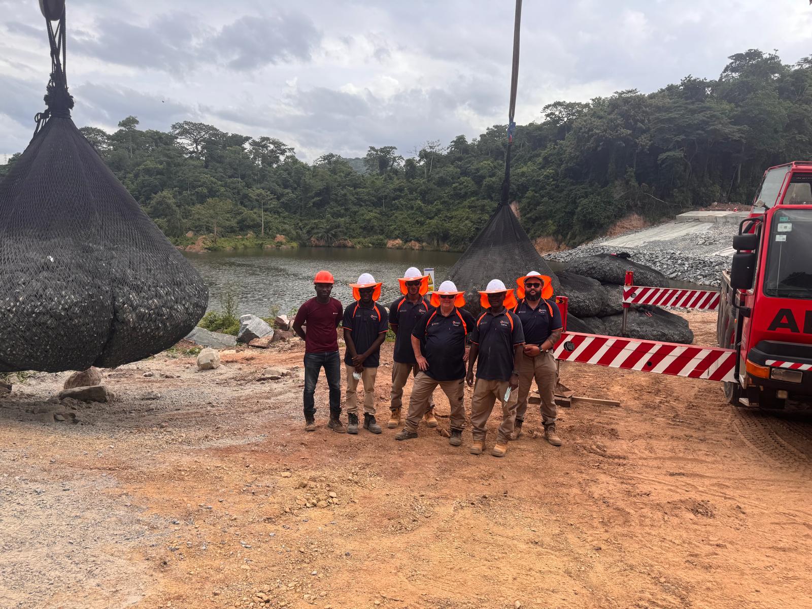 Adlerfields and project team members at the Akosombo Dam worksite