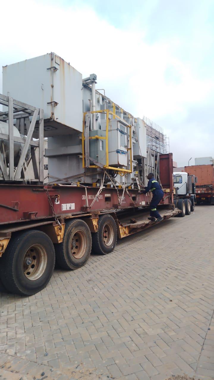 Industrial equipment transported on a lowbed trailer